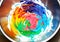 Slime ingredients in mixing container wiht colorful result