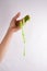Slime paste green elastic and viscous, woman hand holding slime