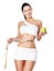 Slimming woman with a measuring tape and apple