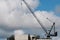 Sling on a construction crane blowing in the strong wind on the new Multistory Unit building under construction at 277 Mann St.