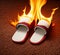 Slippers on fire on carpet background.