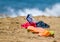 Slippers - kroks and mask on sand beach near the sea water - symbol of summer