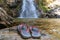 Slippers were placed near the waterfall, carefully thought out of the danger