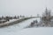 Slippery road, steep slope. Slippery snowy Northern winter road, turn on the road. Kola Peninsula