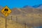 The slippery road warning sign. Drive with caution. California USA, mojave desert USA