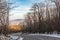 Slippery winding road in a winter mountain forest