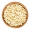 Slivered blanched almonds in wooden bowl over white