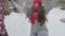 slo-mo authentic cute happy young woman mom in red hat with children take snow with hands throw up over head smile