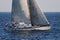 Sloop sailboat USA 18 sailing in open waters.