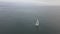 Sloop sailing in calm water