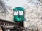 Slope car passing through tunnel of cherry blossom (Sakura)