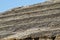 The slope of the roof of reeds and straw