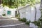 Sloped street of covered by vine arbor, Alpujarras, Spain