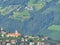 On slopes of mountains beautiful vineyards around the mysterious lock. Northern Italy. Merano.