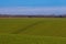 Sloping agricultural fields near Maastricht till the where the border is between the Netherlands and Belgium