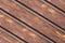 Sloping boards wooden pattern base dark brown parallel sloping country background