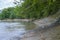 Sloping stony bank of a mountain river.