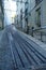 Slopped cobblestone street with tram tracks in the old town, evening scene, Lisbon, Portugal
