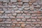 A sloppy brickwork. old red brick wall. rough surface texture