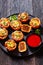 Sloppy joe cups on black plate, top view