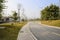 Slopy asphalt road in sunny spring afternoon