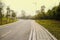 Slopy asphalt road in warm spring afternoon sunlight