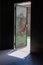 Sloss Furnaces National Historic Landmark, Birmingham Alabama USA, open green metal door, rusted painted steel, sunlight into dark