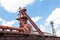 Sloss Furnaces National Historic Landmark, Birmingham Alabama USA, train tracks below tower and pipes, chute