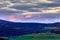 Slovak rural landscape after sunset. Beatiful colorful sky with clouds.