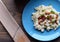 Slovak traditional potato gnocchi with sheep cheese and bacon,wooden table