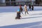 Slovakia, December 2018 ice skating.Small children skate on the rinks .Active outdoor recreation, on the street