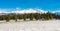 Slovakia: Panorama view of Big Tatra. Big mountains in bacground and forest in foreground Snowy cold weather.