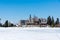 Slovakia: Strbske pleso resort, view of frozen lake in winter and hotel resort above. Blue sky.