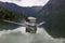 Slovenia lake Skadar bleak day pleasure boat reflected in the water mountains