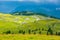 Slovenia velika planina big plateau, agriculture pasture land near city Kamnik in Slovenian Alps. Wooden houses on green land