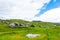 Slovenia velika planina big plateau, agriculture pasture land near city Kamnik in Slovenian Alps. Wooden houses on green land