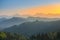 Slovenian breathtaking landscape at sunrise with Julian Alps and charming little church of Sveti Tomaz Saint Thomas on a hill,