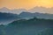 Slovenian breathtaking landscape at sunrise with Julian Alps and charming little church of Sveti Tomaz Saint Thomas on a hill,