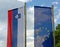 Slovenian and European Union Flags against a Blue Sky