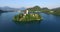 Slow aerial view of little island on the Slovenian lake Bled.