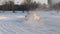 SLOW: Back view of a sport car turns on a winter ice road