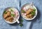 Slow cooker pork tenderloin with rice pilaf and radish salad on a blue background, top view.