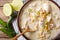 Slow cooker white chili chicken with beans and corn close-up on