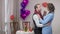 Slow dance of cheerful romantic Caucasian adult couple on Valentine's day. Happy smiling loving man and woman dancing at