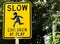 Slow down children at play sign