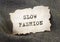 Slow fashion inscription on old vintage paper. Sustainable movement