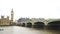 Slow horizontal pan of River Thames and Westminster Bridge in London, defocused