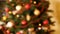 Slow motin defocused video of light circles or bokehs of colorful lights on Christmas tree. Perfect shot for winter