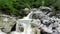 Slow motion of alpin waterfalls in summertime