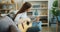 Slow motion of attractive girl enjoying music playing guitar in apartment alone